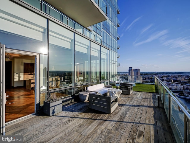 wooden deck featuring outdoor lounge area