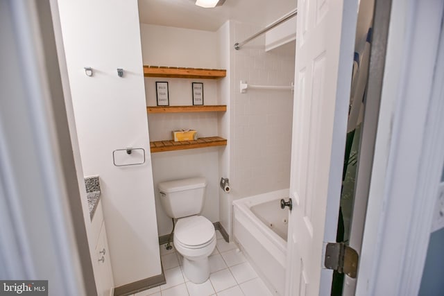 full bathroom with tile patterned floors, tiled shower / bath combo, toilet, and vanity