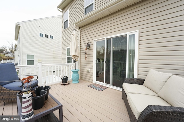 wooden deck with an outdoor hangout area