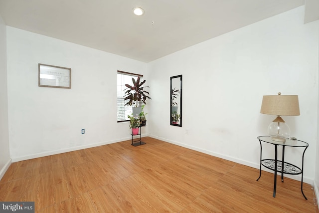 empty room with wood-type flooring