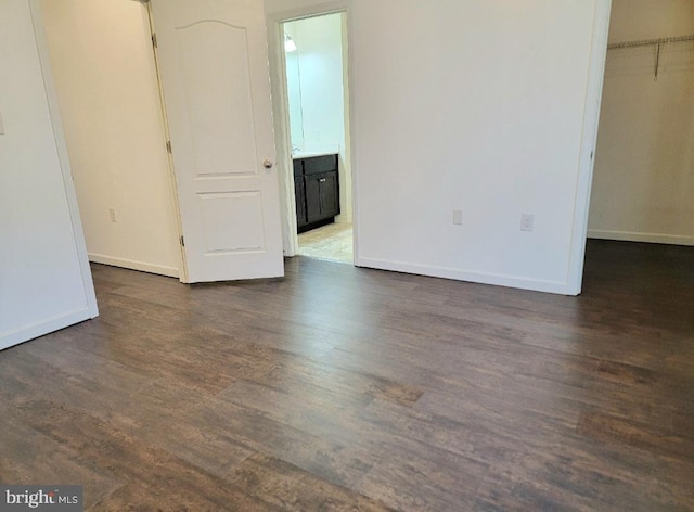 unfurnished room featuring dark hardwood / wood-style floors