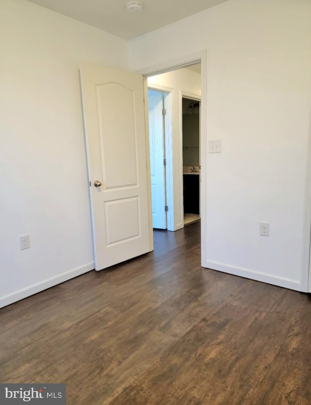 empty room featuring dark hardwood / wood-style floors