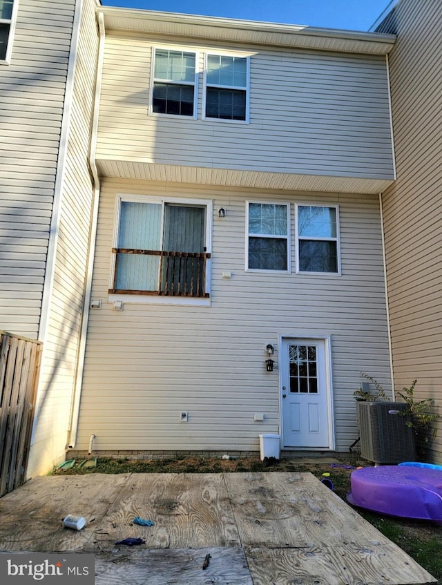 rear view of property featuring cooling unit