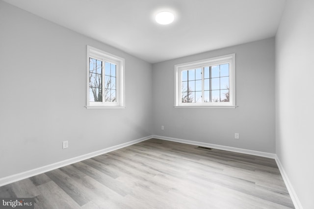 unfurnished room featuring light wood-type flooring