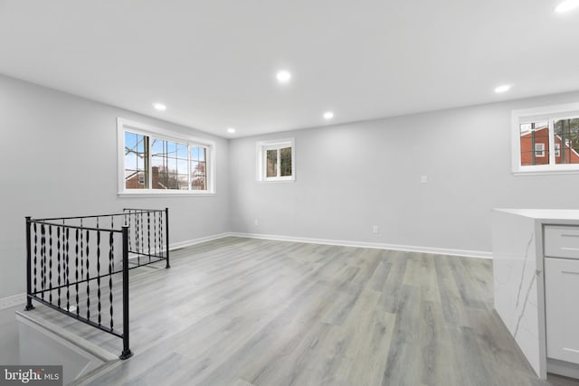 interior space featuring a healthy amount of sunlight and light hardwood / wood-style flooring