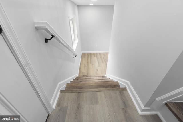 stairs with wood-type flooring