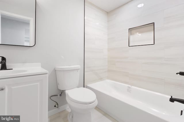 full bathroom with vanity, toilet, and tiled shower / bath