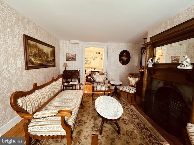 sitting room featuring hardwood / wood-style flooring and a notable chandelier