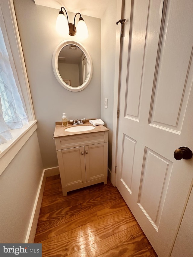 bathroom featuring vanity and hardwood / wood-style flooring