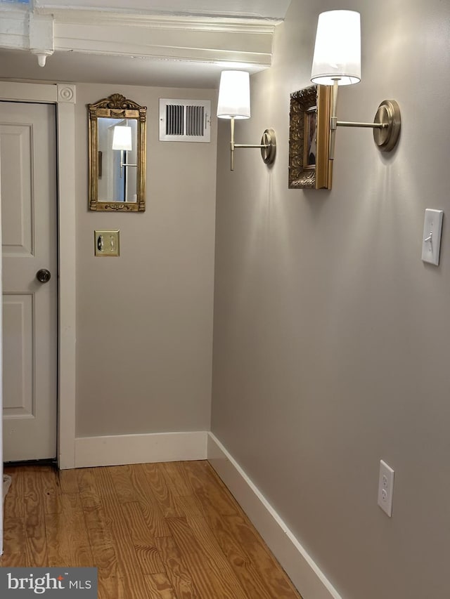 corridor featuring wood-type flooring