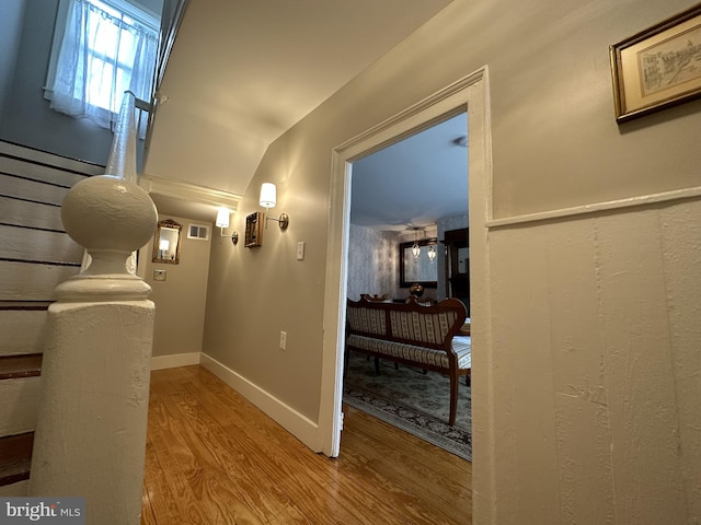 corridor featuring wood-type flooring