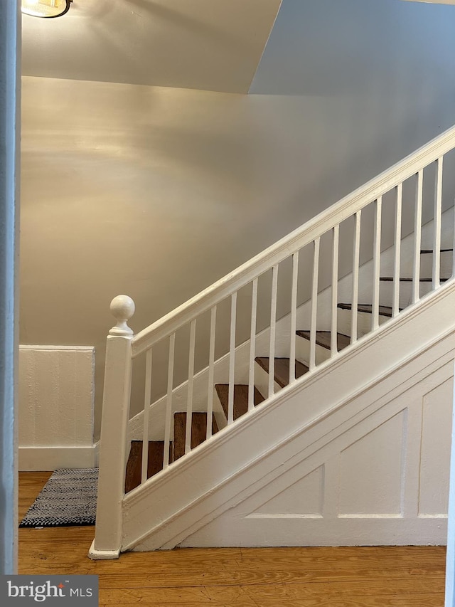 stairway featuring hardwood / wood-style floors