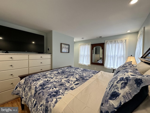 bedroom with light hardwood / wood-style floors