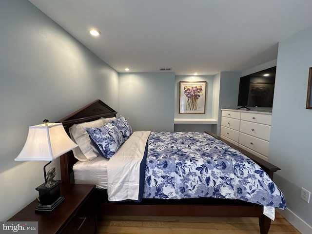 bedroom featuring hardwood / wood-style flooring