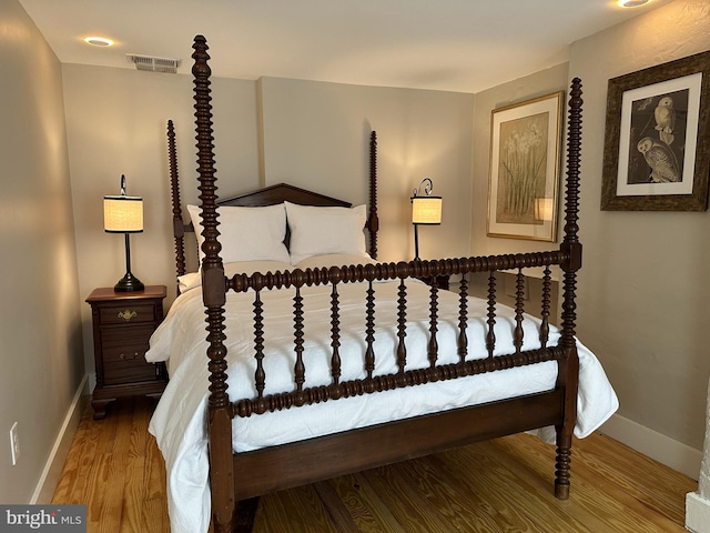 bedroom featuring hardwood / wood-style flooring