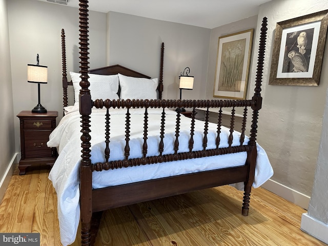 bedroom with wood-type flooring