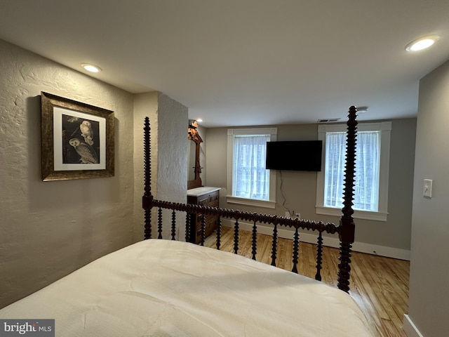 bedroom featuring wood-type flooring