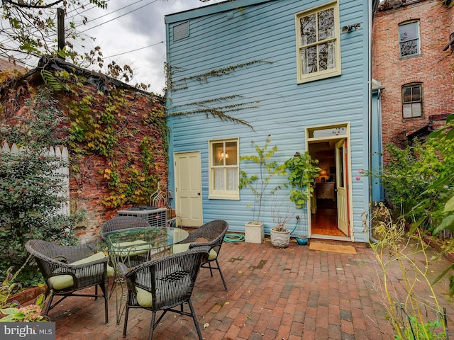 back of property featuring a patio area