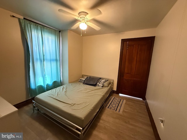 bedroom featuring ceiling fan and hardwood / wood-style flooring