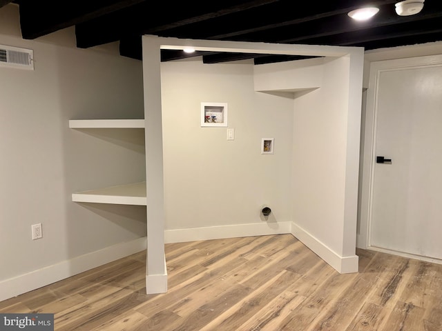 washroom with washer hookup and light wood-type flooring