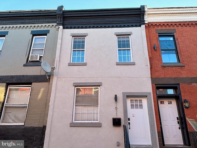 view of front of property with cooling unit