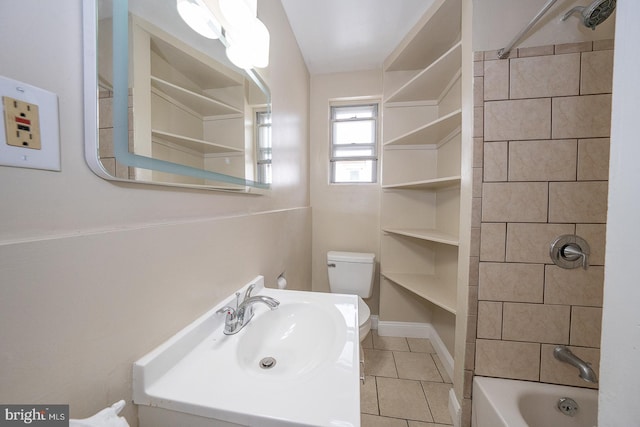 full bathroom with tile patterned flooring, vanity, toilet, and tiled shower / bath