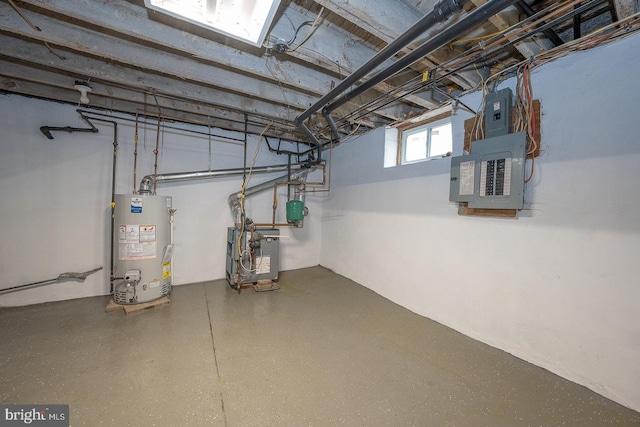 basement featuring electric panel and gas water heater