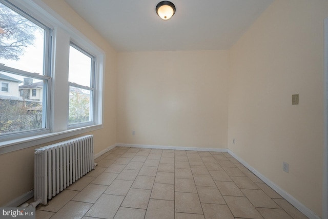 tiled empty room with radiator heating unit