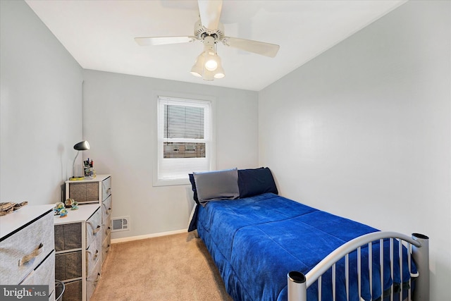 carpeted bedroom with ceiling fan and lofted ceiling