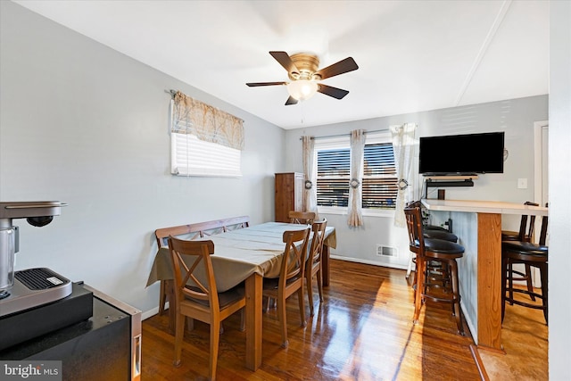 dining room featuring hardwood / wood-style flooring and ceiling fan