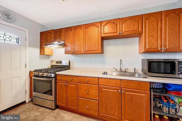 kitchen with sink and appliances with stainless steel finishes