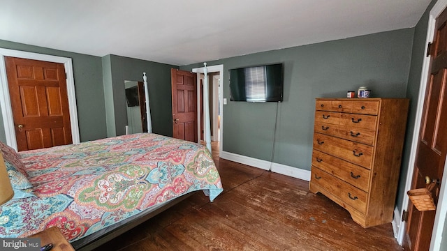 bedroom featuring dark hardwood / wood-style flooring