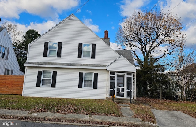 view of front of house with a sunroom