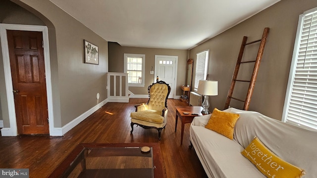 sitting room with dark hardwood / wood-style flooring