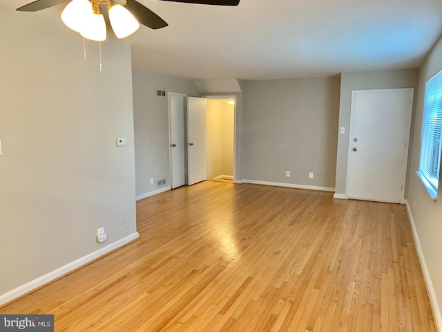 spare room featuring ceiling fan and light hardwood / wood-style floors