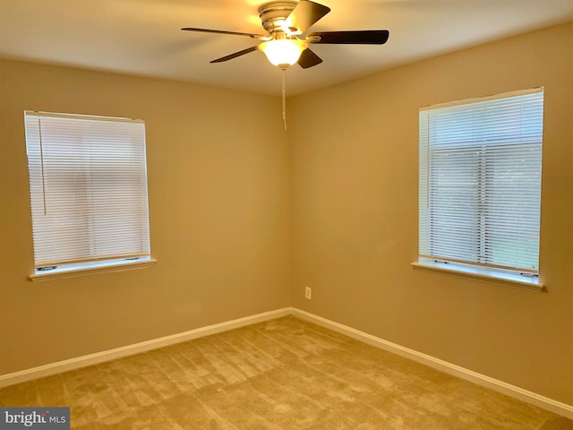 carpeted empty room with ceiling fan