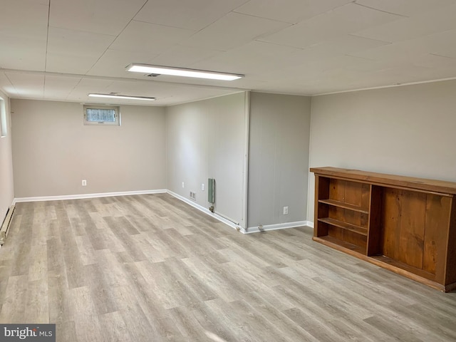 basement featuring light hardwood / wood-style flooring