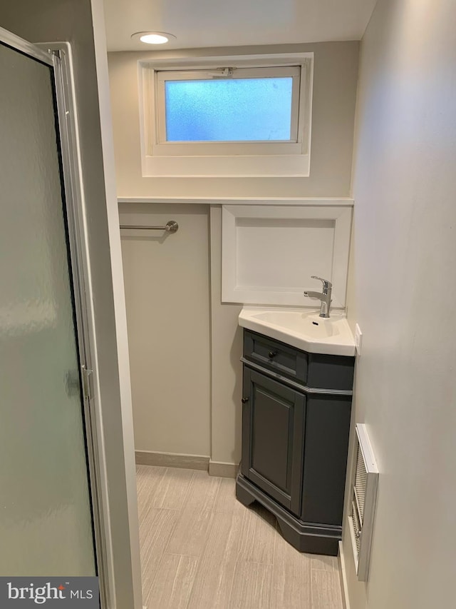 bathroom featuring vanity and walk in shower