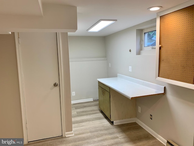 washroom with light hardwood / wood-style flooring