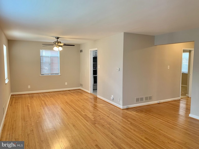 spare room with light hardwood / wood-style flooring and ceiling fan