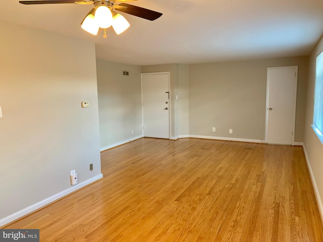 spare room with light hardwood / wood-style floors and ceiling fan