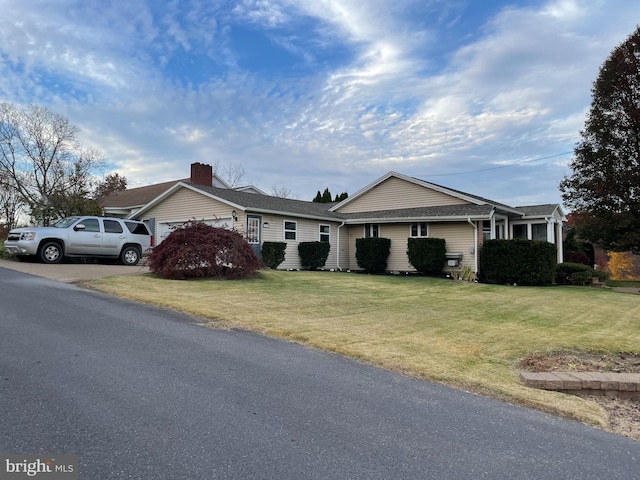 single story home with a front yard