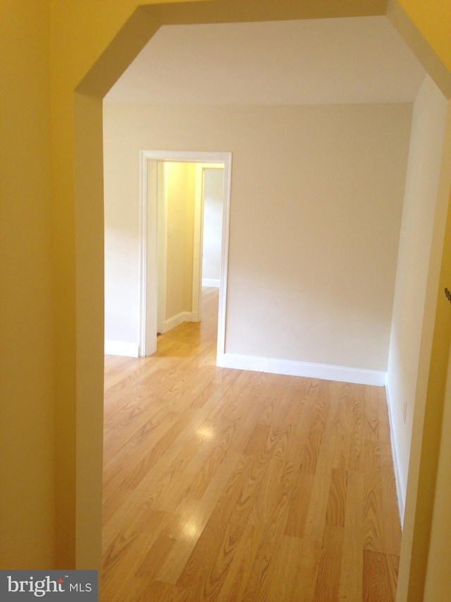 corridor with light wood-type flooring