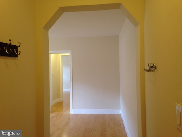 hallway with light wood-type flooring