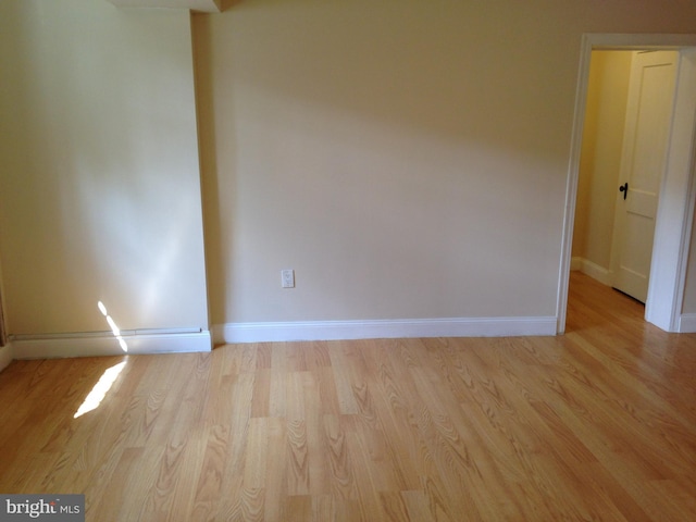 spare room featuring light hardwood / wood-style floors