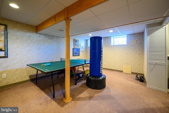 playroom featuring light colored carpet and a drop ceiling