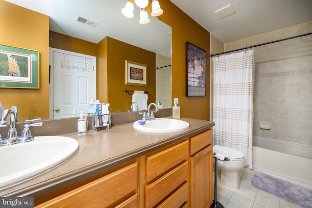 full bathroom with tile patterned flooring, vanity, shower / tub combo, and toilet