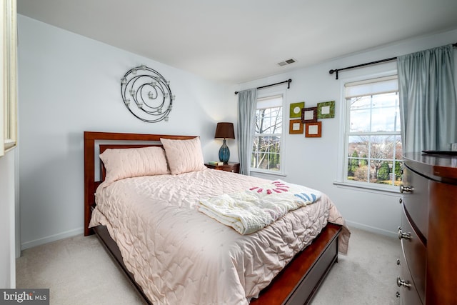 bedroom with light colored carpet