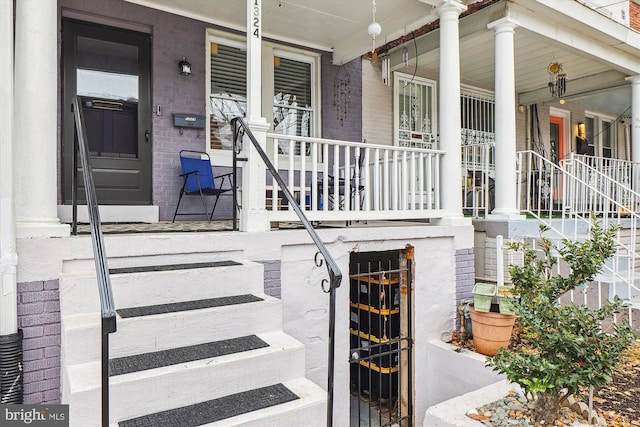 entrance to property featuring covered porch