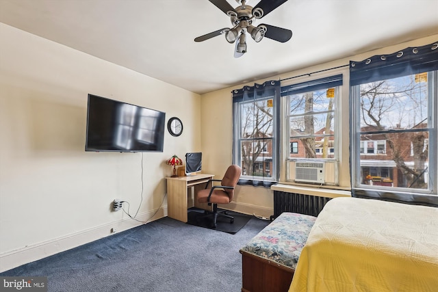 bedroom featuring cooling unit, radiator, ceiling fan, and carpet